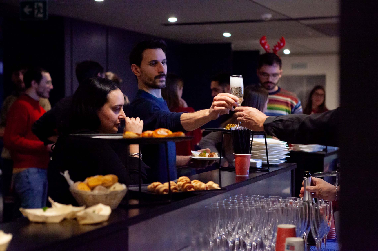 TVA team members eating aperitivo at the Christmas party TVA team members eating aperitivo at the Christmas party