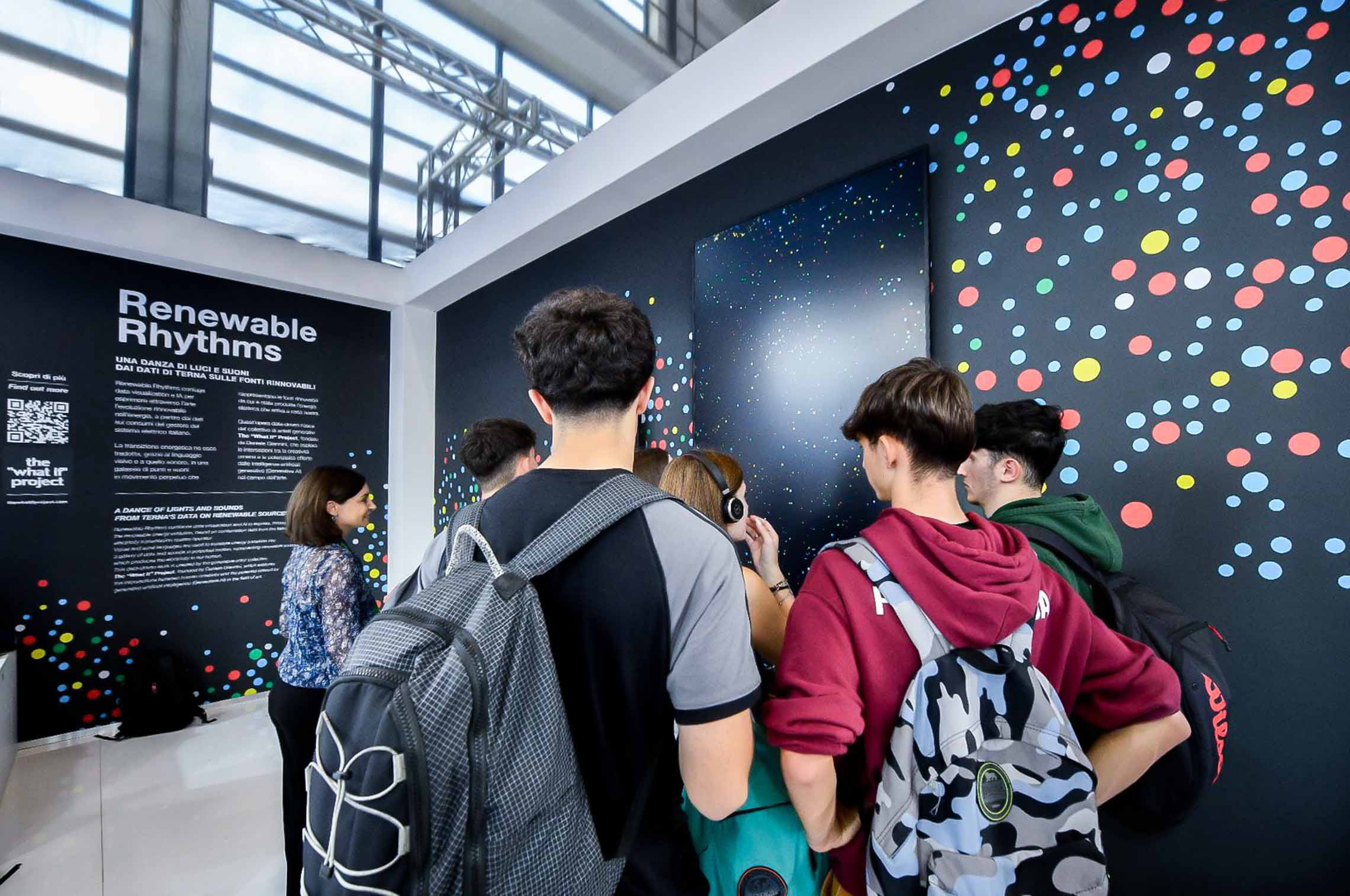 People standing in front of the Renewable Rhythms’ exhibitions dashboard People standing in front of the Renewable Rhythms’ exhibitions dashboard